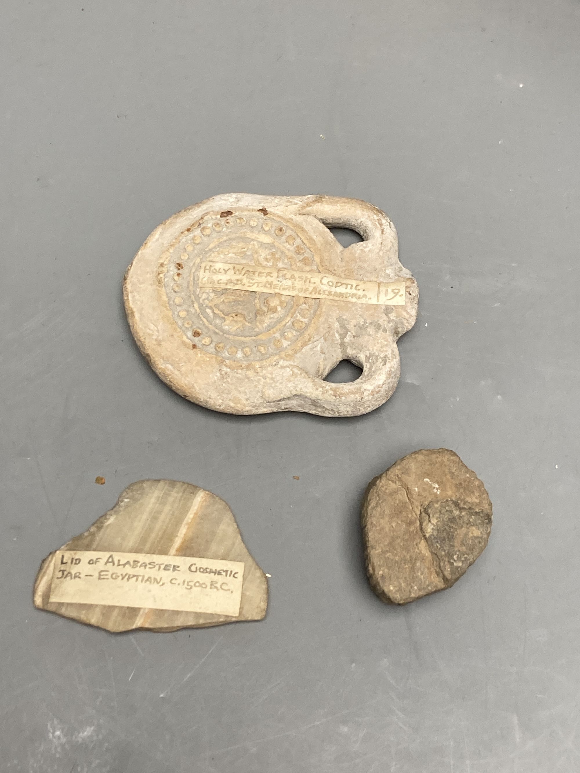 A group of Egyptian pottery fragments, Coptic period, together with a Syrian Islamic pottery oil lamp fragment